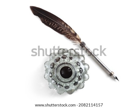Quill pen with a glass bottle of ink. Top view Royalty-Free Stock Photo #2082114157