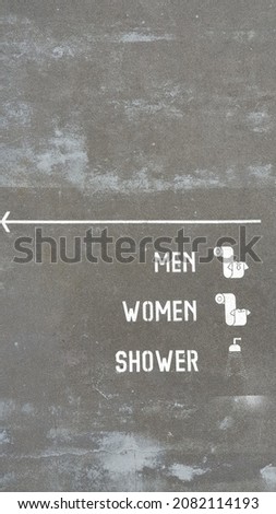 Toilet Sign on the floor outdoor