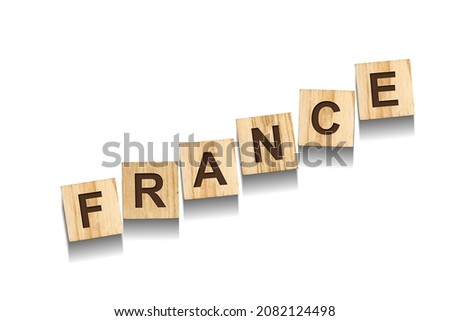 France, word on wooden blocks. Isolated on a white background. Signs and Symbols.