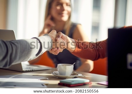 Job applicant and a commission is getting know each other in a relaxed atmosphere during a job interview. Business, people, company Royalty-Free Stock Photo #2082150556