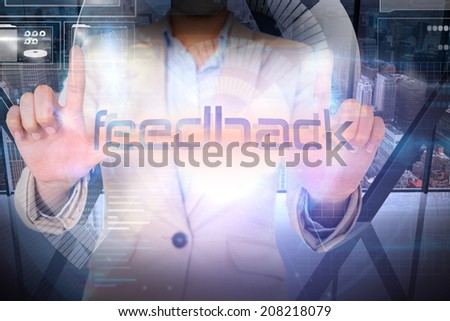 Businesswoman presenting the word feedback against room with large window looking on city