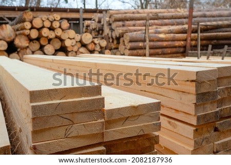 Sawmill. Wooden planks at a sawmill or in a carpentry workshop. Sawing and drying of wood. Woodworking industry