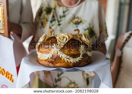 one of the Russian traditions at the wedding is to meet the newlyweds with a loaf of bread