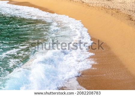 waves on the coastline of the beach in the day time, top angled view