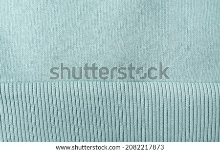 Mint color jersey, fabric as a background, full frame. Close-up. Royalty-Free Stock Photo #2082217873
