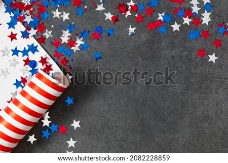 4th of July American Independence Day. Presidents Day. Red, blue and white star confetti, decorations on gray stone background. Flat lay, top view, copy space, banner