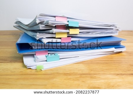 blue files folder and paper for business on wood table 