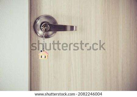 Open door with keys, Real estate agent showing new house