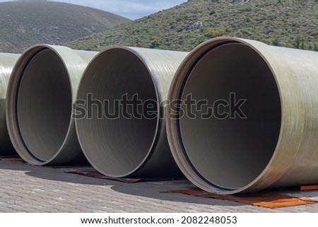 rubber gasketed grp (frp) pipes are kept at the shipping site Royalty-Free Stock Photo #2082248053