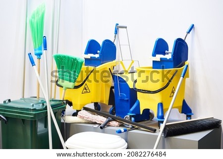Cleaning trolleys, brushes and buckets in store exhibition