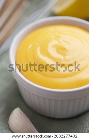 Spanish aioli sauce prepared with garlic, oil and eggs yolk. Aioli is an emulsion or suspension of small globules of oil, close up