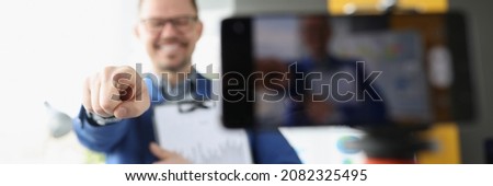 Male blogger points finger at camera. Individual approach to learning concept Royalty-Free Stock Photo #2082325495