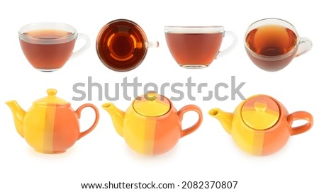 Collection ceramic teapots and cups with tea at different angles isolated on white Royalty-Free Stock Photo #2082370807
