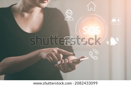 Woman using Smart Phone with Emergency app in home, call phone, Chat message icon, Emergency application from smartphone for elderly, technology concept.Old hand touch mobile phone and call for help.