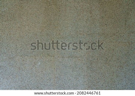 Rough textured wall surface. Background with copy space for text or inscriptions. A template for a design or a graphic resource for a designer. Bottom layer, backing.
