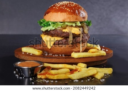 Close-up of home made tasty burger on wooden table