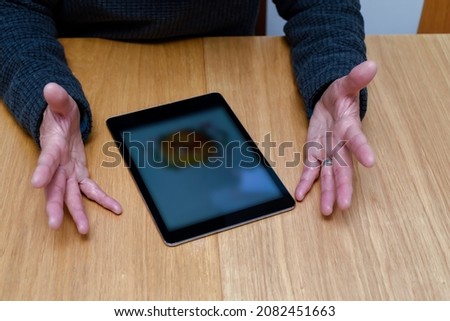 Man is angry and frustrated and does understand new technology in the tablet computer