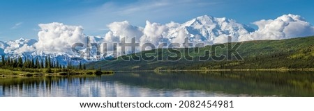 Wonder Lake is deep on the western end of Denali National Park. It is a great place to view Denali and the Alaska Range. Days like this Denali towers above the clouds while the range is hidden. 