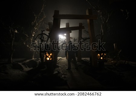 Creative artwork decoration. Abstract Japanese style wooden tunnel at night. Night scene in fantasy forest. Selective focus