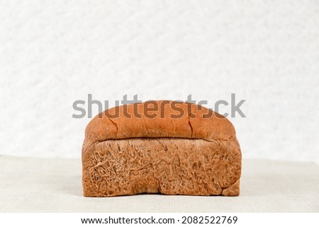 Choco bread loaf on a white background. Chocolate flavor