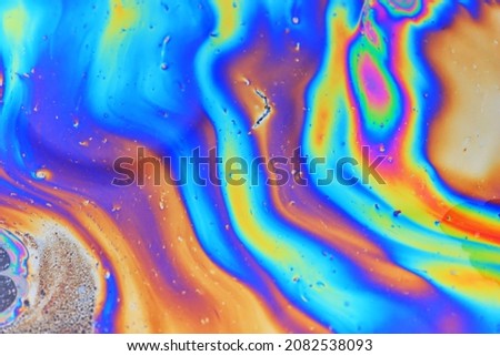 abstract background gasoline art colored, texture oil multicolored rainbow abstract gasoline spill Royalty-Free Stock Photo #2082538093