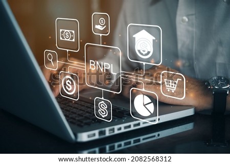 BNPL Buy now pay later online shopping concept. Businessmen using a computer to BNPL with online shopping icons technology. Royalty-Free Stock Photo #2082568312