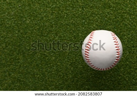 Green sports golf course and ball. Minimalism. There are no people in the photo. Professional and amateur sports, healthy lifestyle, recreation, relaxation, advertising, banner.
