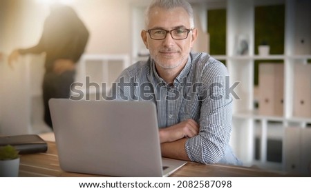 portrait of a 45-year-old businessman at work Royalty-Free Stock Photo #2082587098
