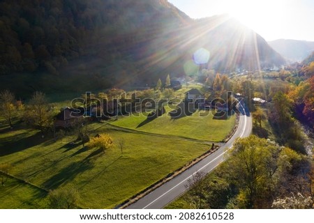 Aerial view of authentic traditional villages from Apuseni area in Romania during autumn sunset Royalty-Free Stock Photo #2082610528