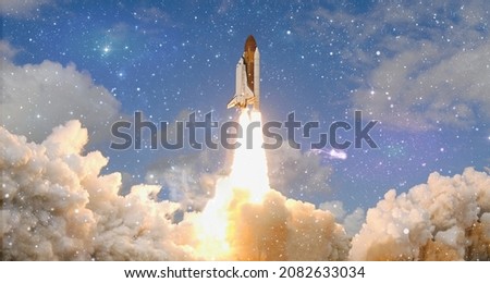 Concept of business product on a market. Spaceship takes off in the starry sky. Rocket space ship.Elements of this image furnished by NASA