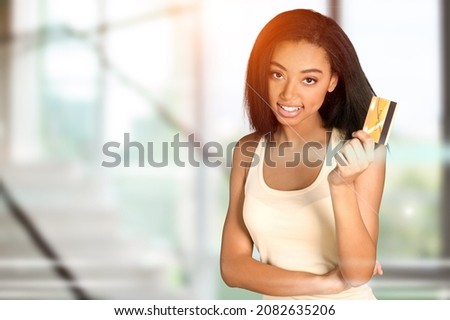 Person holding showing plastic credit card with various icon concept payment