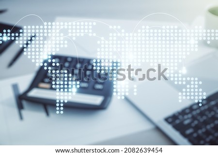 Abstract virtual world map with connections on calculator and laptop background, international trading concept. Multiexposure Royalty-Free Stock Photo #2082639454