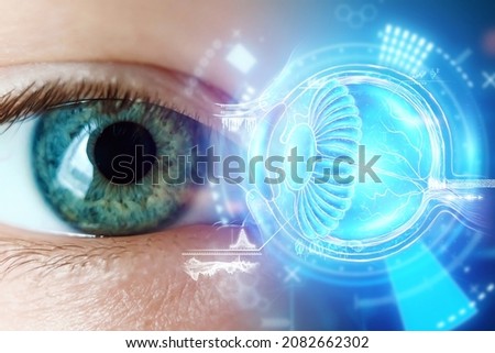 Realistic hologram of human eye and real eye close-up. Vision concept, laser eye surgery, cataract, astigmatism, modern ophthalmologist Royalty-Free Stock Photo #2082662302