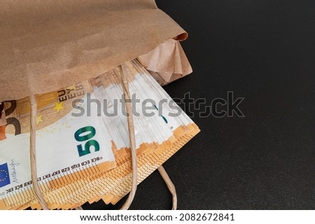 Euro banknotes. Cash in a paper bag on the table. The concept of corruption and illegal money