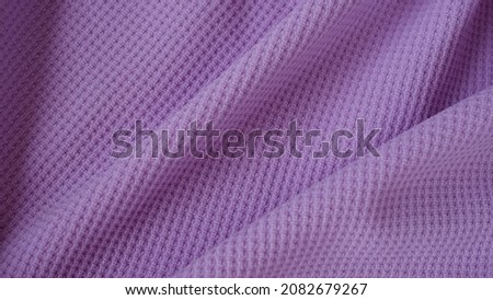 Spandex jersey knit fabric texture with elegance and drapery textile patterns in soft purple color. Luxury and beautiful fabric material. Royalty-Free Stock Photo #2082679267