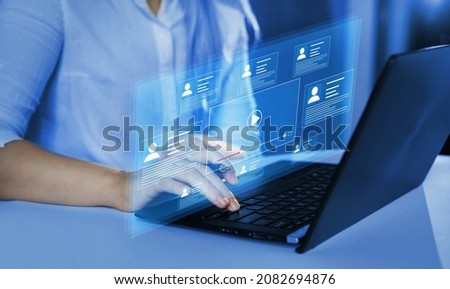 Concept of online work, online documents, confidentiality and jobs.Manager holds an online conference with his employees on virtual  screen.  Royalty-Free Stock Photo #2082694876