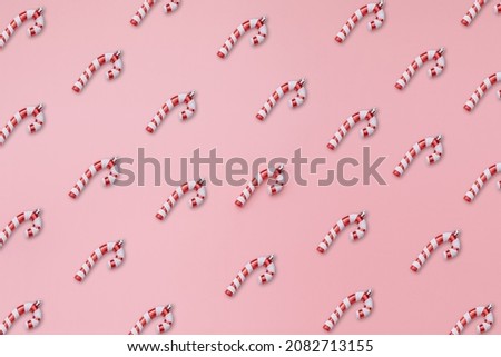 Collection of Christmas walking stick on pink background