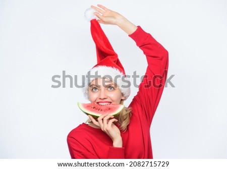 Christmas summer destinations. Travel vacation and holidays resort. Christmas girl eat watermelon. Woman santa hat hold slice watermelon. Exotic christmas celebration. Tropical christmas concept