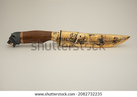 A Damascus Knife on Neutral Background