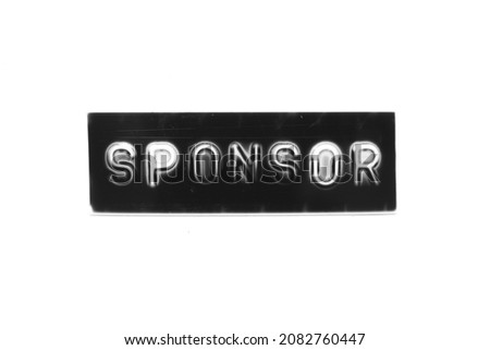 Black color banner that have embossed letter with word sponsor on white paper background