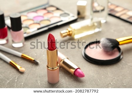Set of decorative cosmetics on grey background. Top view
