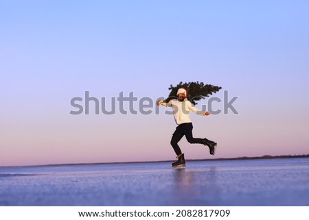 Santa Claus hurries to meet the New Year with gifts and Christmas tree. Santa Claus on ice skates go to Christmas.