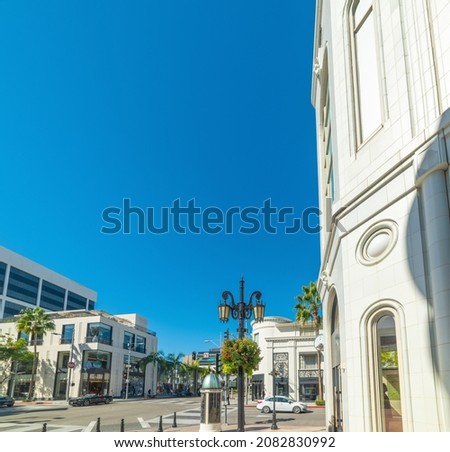 World famous Rodeo Drive in Beverly Hills under a blue sky. California, USA