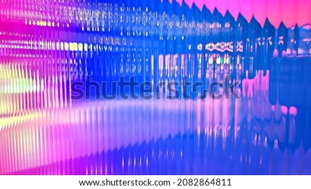 abstract iridescent polycarbonate texture background. close up view. holographic foil on polycarbonate. real modern trendy colorful wall background. Royalty-Free Stock Photo #2082864811