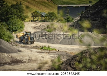 picture of mining in a quarry with demolition equipment, industrial photography, mining and environmental destruction