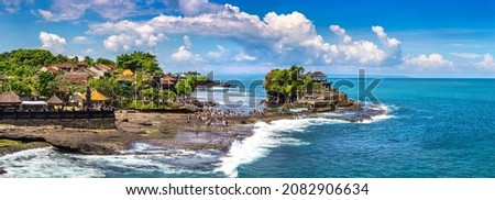 Panorama of  Tanah Lot temple on Bali, Indonesia in a sunny day Royalty-Free Stock Photo #2082906634