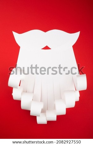 Santa Claus beard Christmas white and red conceptual paper background with copy space for your text