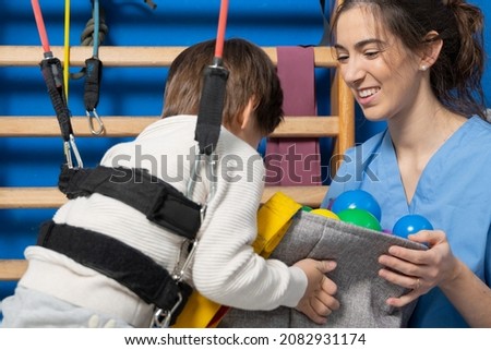 Disabled child is playing, learning and exercising in rehabilitation therapy hospital, Lifestyle of a child with disability. Happy disability kid concept .