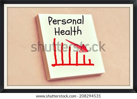 Text personal health goes down on the graph on the short note texture background