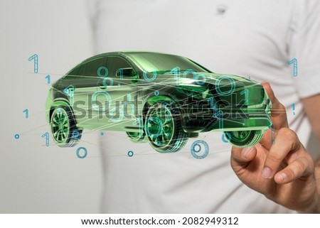 Man holding and touching holographic smart car 